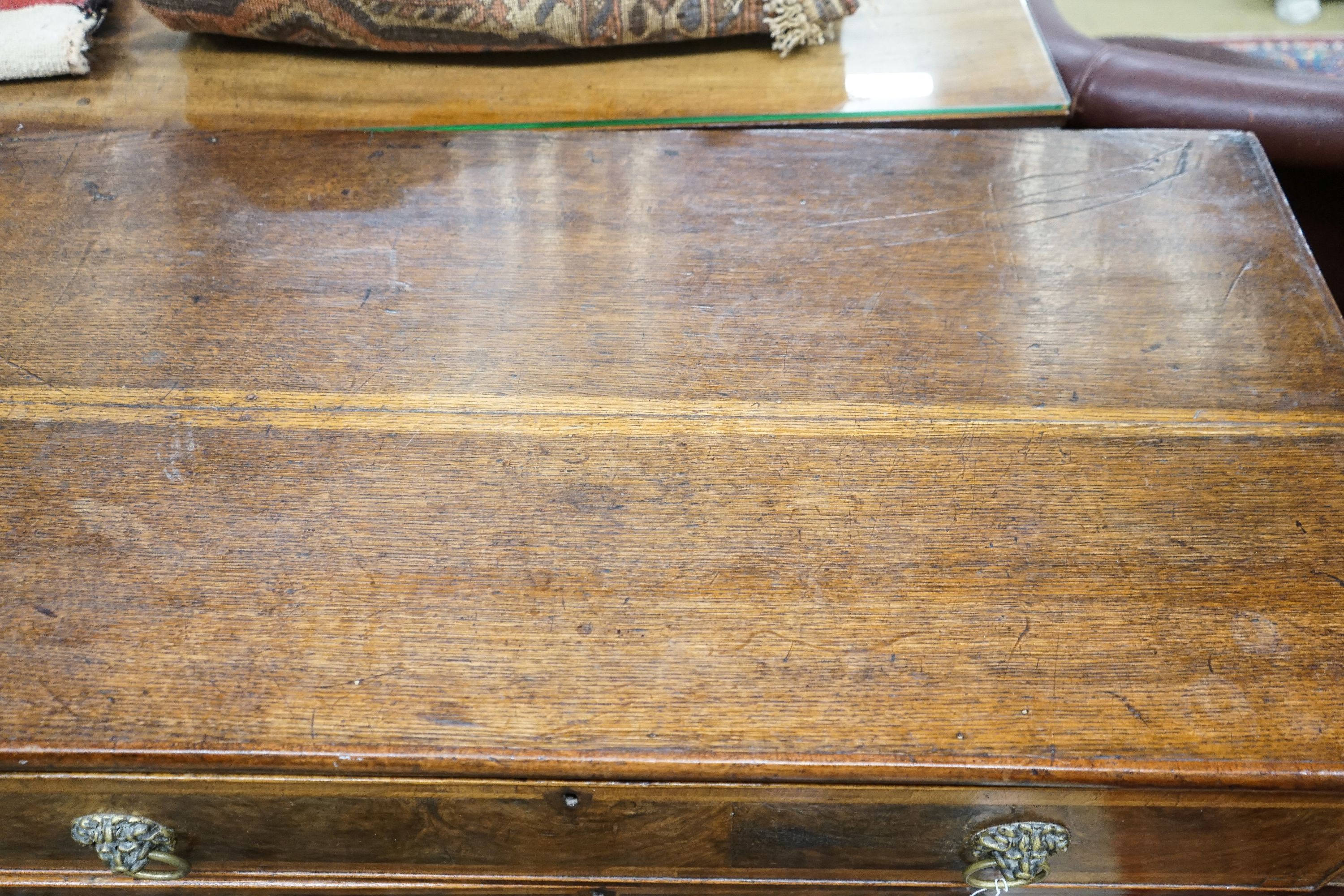 A walnut and oak chest of drawers, width 103cm, depth 52cm, height 82cm